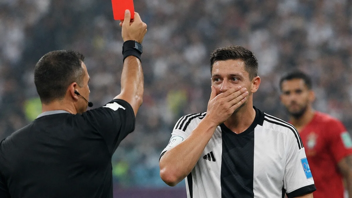 World Cup Player Receives Red Card for Covering Mouth Gesture